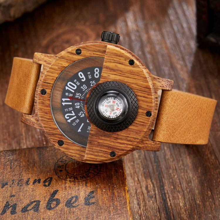 Wooden wristwatch with a compass on a wooden surface